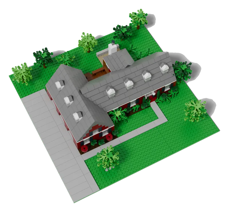 Aerial view of a brick-built Cape Cod model on its lot