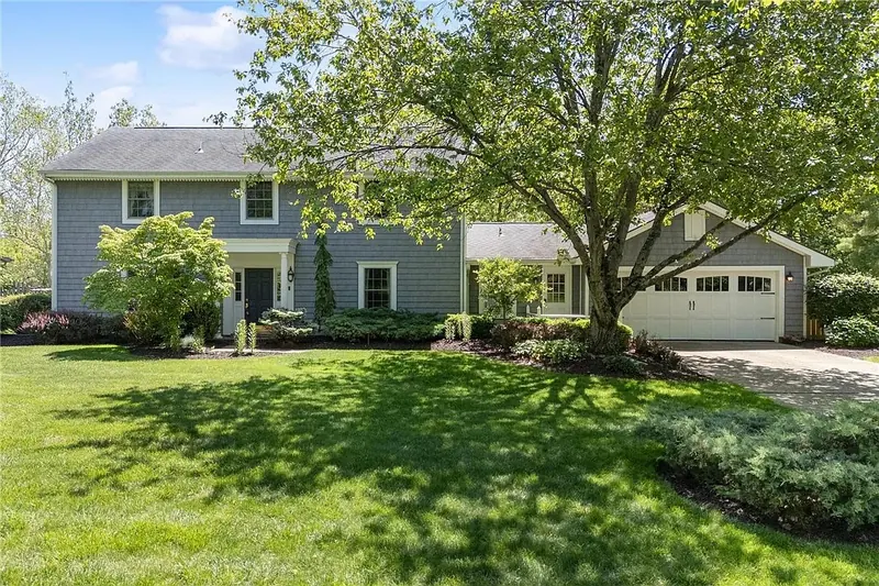 Photo of a blue-gray Colonial home