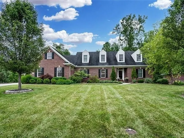 Photo of a red-brick Cape Cod home
